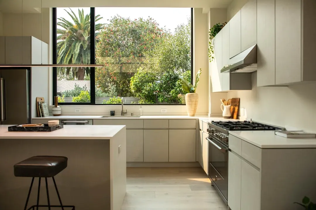 well-lit kitchen with wooden cabinets and modern appliances